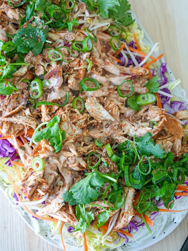 Finished Bang Bang Chicken Salad beautifully arranged on a platter.