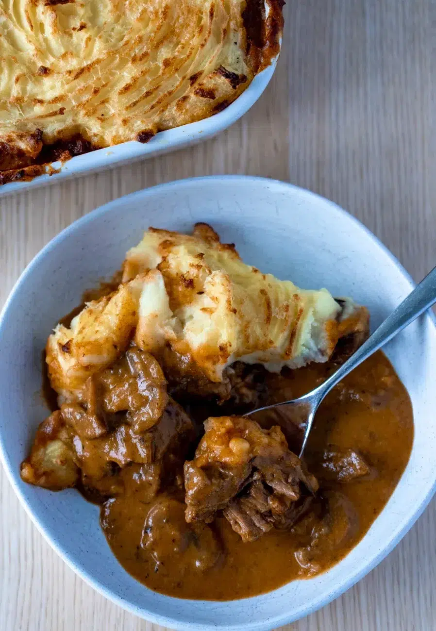 This is cottage pie with a difference! The filling is a creamy beef stroganoff and the topping is made cheesy and crispy with a layer of parmesan.