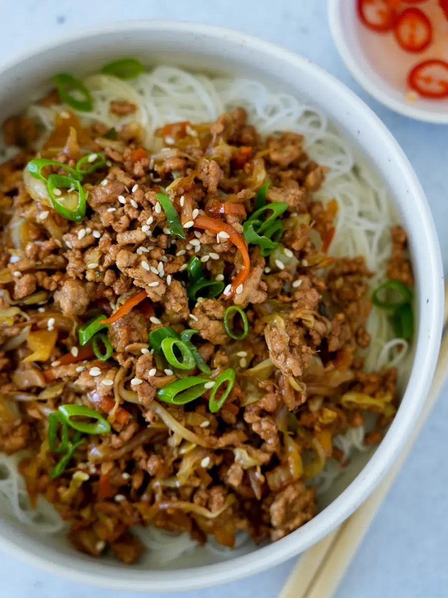 Close up of Spring Roll Bowls Stir-fry with chopsticks